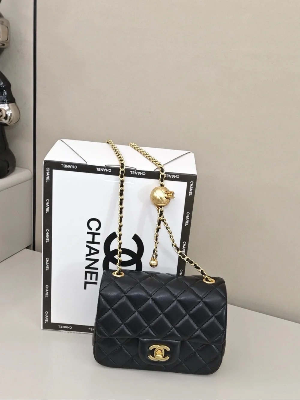 CHANEL Black Quilted Mini Flap Bag with Gold Chain